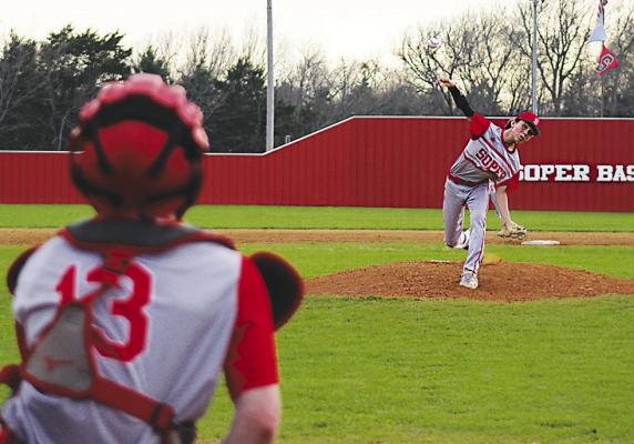 SOPER RED BEAR HURLER BRAXTON CARTER lets a pitch go to the team’s catcher Teagen Stacy during recent action on the home field. Braxton held Clayton to just two hits boosting the Red Bears to a 9-1 victory. Brian Moore Photo