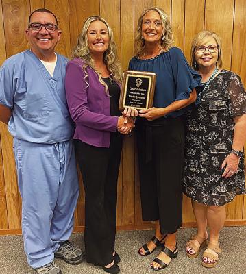 Kristin Lemmons was recently honored as the Hugo Public School District Teacher of the Year. Kristin has been with Hugo Schools for 27 years. “She is an amazing teacher and role model to her students,” Superintendent Brandy Blalock said. “Congratulations Mrs. Lemmons, this honor is well deserved.” Pictured (l to r): Board member Dr. Mike Irvin, Brandy Blalock, Kristin Lemmons and board member Dama McLemore.