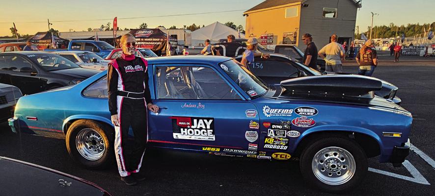 ANDREA RUFFIN takes a moment for a photo while prepping her car “Joy Ride” for the IHRA SUPER SERIES World Finals in Holly Springs, Mo.
