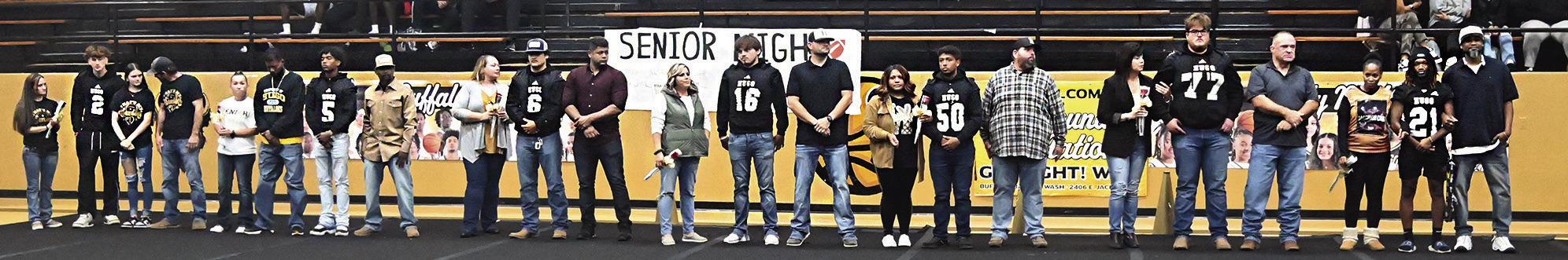 THE HUGO BUFFALO FOOTBALL SENIORS were recognized by parents, teachers, teammates, fellow students and fans Friday during a special ceremony at Simon Parker Gymnasium. Hugo News Photo / Stan Stamper