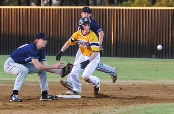 BOSWELL’S BRANDON ANDERSON goes in standing up and safe at second ahead of the catcher’s throw. (Above) J.W. Dill slides into home plate under the throw as the umpire calls... “SAFE!” Hugo News/Bobby Hamill