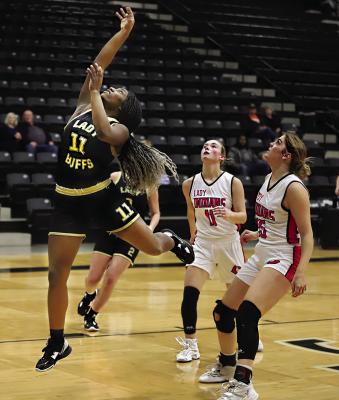 KE’SHAWNA SCROGGINS outraces two defenders to put up a shot against Comanche in a do-or-die game for the Hugo Lady Buffaloes. Hugo News Photo / Kelli Stacy