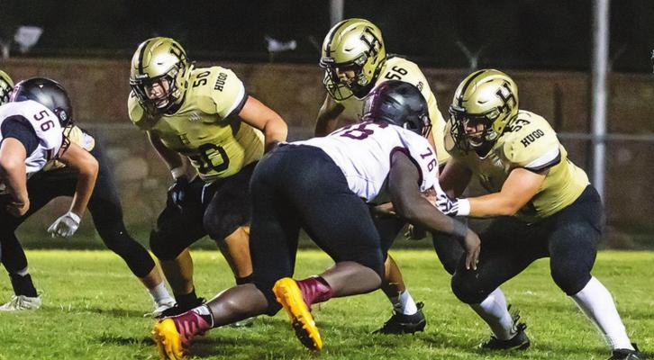 Battle in the trenches... HUGO BUFFALO LINEMAN worked hard in the trenches against Atoka, and performed well on both sides of the football. Above, Caleb Joe, Kameron Allred and Noah Joe keep Atoka players away from Hugo’s quarterback. Hugo News Photo / Bobby Hamill