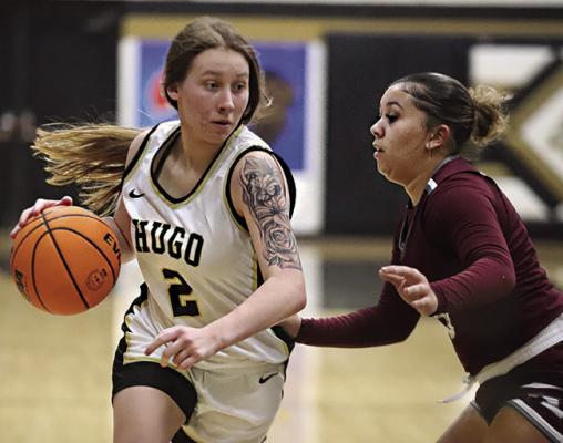 CALISTA KELLEY moves the basketball inside looking for an outlet pass during recent Hugo Lady Buffalo basketball action against Ada. Hugo News Photo / Kelli Stacy