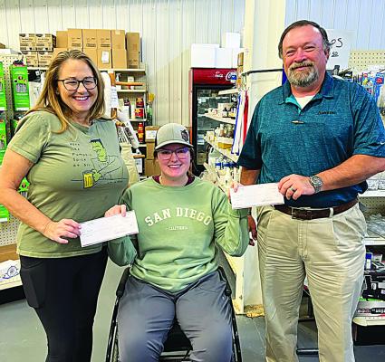 We muffed! Announced as last week’s winner was Edward Johnson (left), who obtained his entry form at First United. He is pictured with First United’s Amy White. Bobby Yandell (above right), of Hugo, was the actual winner of last week’s contest, after choosing 16 out of 18 games correctly. He obtained his winning entry blank at Red River Co-Op, and is pictured with Hailey Morris.