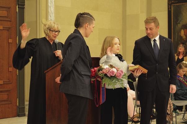 Katelyn Tally (center front) of Valliant takes the oath of office as Oklahoma’s Kid Governor for 2026 during a State Capitol ceremony on Mon., Feb. 2. Katelyn is surrounded by her mother Jessica Fulgham (front left) and father, Brandon Talley, as she takes the oath. Oklahoma Supreme Court Justice Noma Gurich administered the oath. Photo Courtesy / OICA