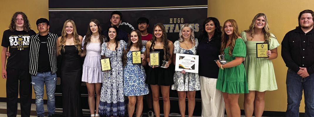 HHS CHEER TEAM (l-r) Kase Burton, Sam Perez, Brooklyn Brook, MaKatlynn Sanchez, Kayla Freeman, Breona Cochnauer, Ja’Miya Johnson, Gracie Armstrong, Coach Angie Citty, Kacie Reynolds, Keara Nelson, Jayse Trantham. Back row: Zaven Siniga and Robbie Bautista.