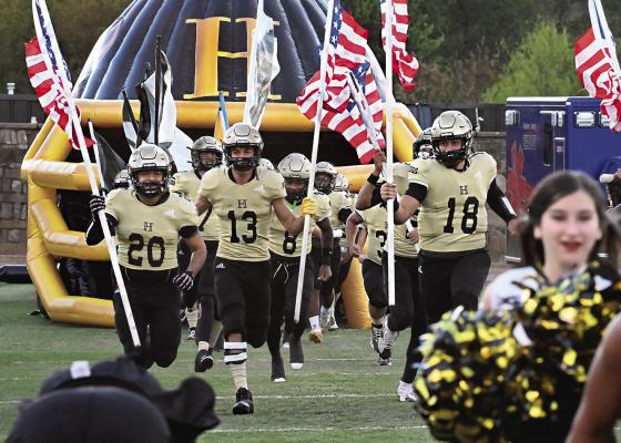 HUGO BUFFALO SENIORS led the Buffaloes onto Buff Parker Field Friday carrying both the nation’s and the school’s colors. Seniors included: Jayka Santillan, Zaven Siniga, Sam Perez, Zakk Gilmore, Ja’Mari Scroggins, Kadyn Jones, Kamarien Pugh, Kamden Bostic, Gunner Santillan and Keiondre Locke. Hugo News Photo / Stan Stamper