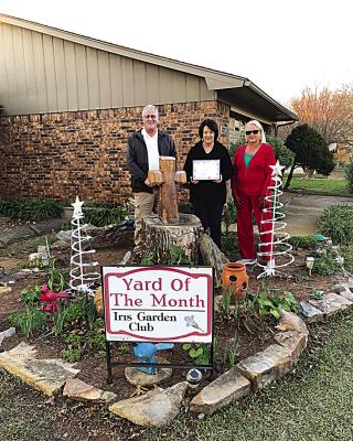 Iris garden club Yard of the Month for December is Terry and Debbie Park in Jay Mac Addition. Chosen for their beautiful Christmas lights and decorations, they maintain their property beautifully all the time. Pictured are the Parks and club President Harolynn Wofford.