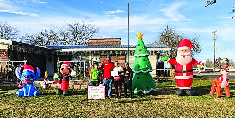Iris Garden Club Yard of the Month for Christmas was Joshua and Amanda Winters at 1307 E. Duke. Their display featured Santa and sleigh, Christmas trees, snowmen, reindeer and lots of lights. They won a $50 ACE gift card for their efforts.