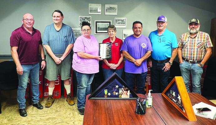 The tow n of Soper was officially proclaimed a Purple Heart town recently. The proclamation recognizes and honors military members who were wounded or killed in combat while serving in the United States Armed Forces. Pictured above with State Purple Heart Ambassador Steve Byrd are: Mayor Cary Lester, vice-mayor Justin Logue, council member Ellen Trout, SPWA clerk Jeannie Pierce, Byrd, code enforcer Becky Futrell, councilmember Jim Salle. Not pictured were Terri Mays and Larry Wynn.