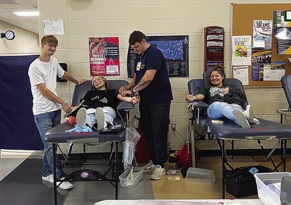 Hugo High School students donate at OBI Blood Drive hosted by the Leo Club on Sept. 7 at Hugo High. Pictured are: Chad Barnett, Jodi Emberson, OBI Tech, and Kendell Hicks.