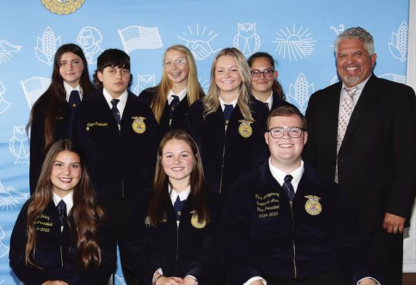 Officers attending from the Hugo chapter were: President Tatum Fancher, Vice-President Averie Mitchell, Secretary Shaynn Steele, Treasurer Jaleigh Loper, Reporter Olivia Ketchum, Sentinel Colton Crowson and Adviser Nathan Coulter. Also pictured are two state FFA officers Kayla Poling (front left) and Titus Montgomery (front right).