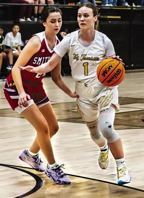 MADISON HUDSON takes the ball up the court for the Fort Towson Lady Tigers.