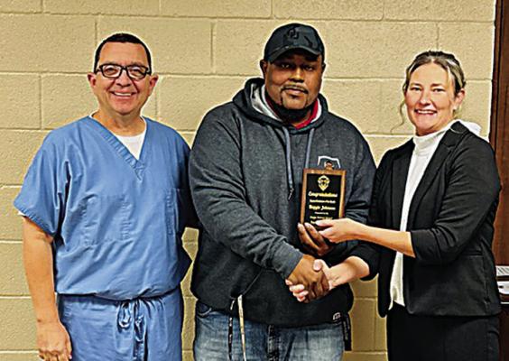 above: The Hugo School Support Employee of the Month was Reginald Johnson, Maintenance Custodian at Hugo High School. He is pictured with board member Dr. Mike Irvin and Superintendent Brandy Blalock.