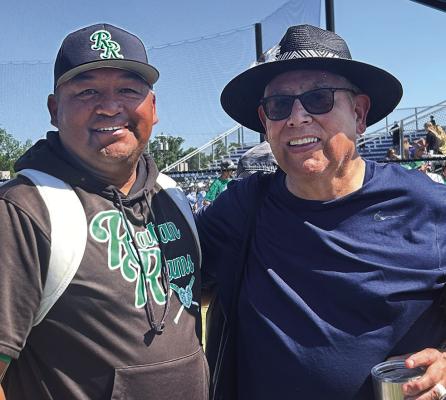 HALL OF FAME COACHES, Michael Clay (left) and Alan Simpson enjoyed a celebrative moment after the Rattan Rams had earned their 9th State Title Saturday at Shawnee.