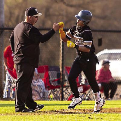 MALIKI GILLEAN ripped the Buffaloes’ first homerun of the season last week against Sulphur and gets a congratulatory fist bump from head coach Scott Schier as he rounds third base. Currently leading the Buffaloes at the plate with a .360 batting average is D.K. Wilson (.429 OBP with nine hits), followed by Jayka Santillan (313), Dakota Coulter, Colby Worthy and Trystunn Fleeks (.250). Hugo News Photo / Bobby Hamill