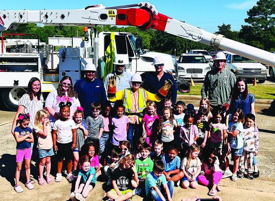 Hugo Elementary students get hands-on with linemen at PSO’s Touch-A-Truck event