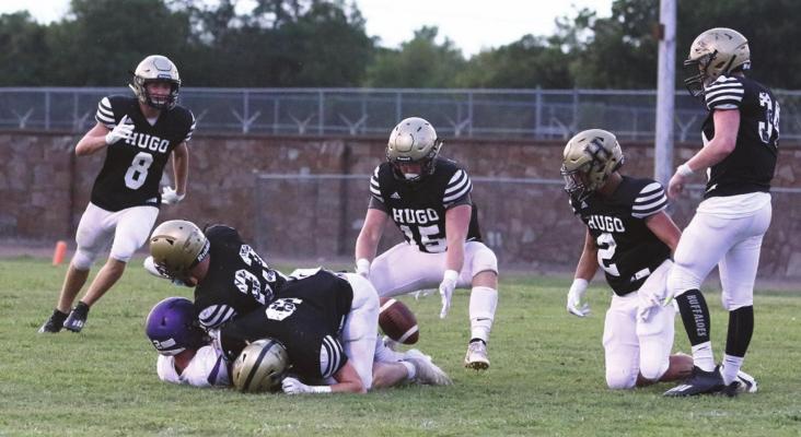 LIGE WHITE puts a fierce tackle on a Coalgate ball carrier, forcing a fumble that is pounced on by teammate Tony Perry during the Buffaloes pre-season scrimmage Friday night in Hugo. Closing in to assist on the tackle were Ashton Barnett, Jace Moffitt, Hunter Sims and Chance Marzek. The Buffaloes open their 2020 fall football season at home Friday, Aug. 28 against Dickson. Kickoff is at 7 p.m. Hugo News Photo / Bobby Hamill