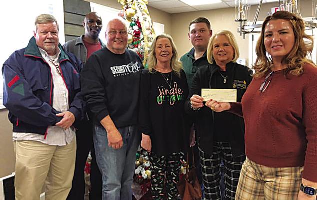 Hugo Lions Club news! The Hugo Lions Club recently presented a check to Youth Services for the Angel Tree. Lions President Harolynn Wofford and members Clark Leforce, Chris Scott, Mike and Susan Brewer, and Royce Chandler are pictured with Youth Service Director Brandy Krohn.