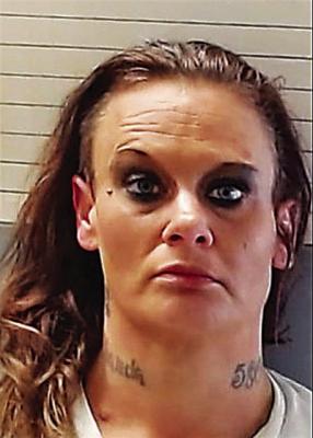 Woman arrested after admitting to arson