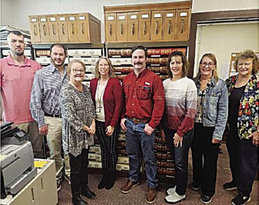 The Kiamichi Conservation District received a REAP Grant on Feb. 15 in the amount of $59,708. The monies will go to purchase a district vehicle, two 500-gallon sprayers and a hay buggy. Pictured (l to r): Johnny Sokolosky, Travis Dill, Lisa Payne, Kim Rose, John McQuaig, Kylee Edge, Kim Bush and Linda Loper.