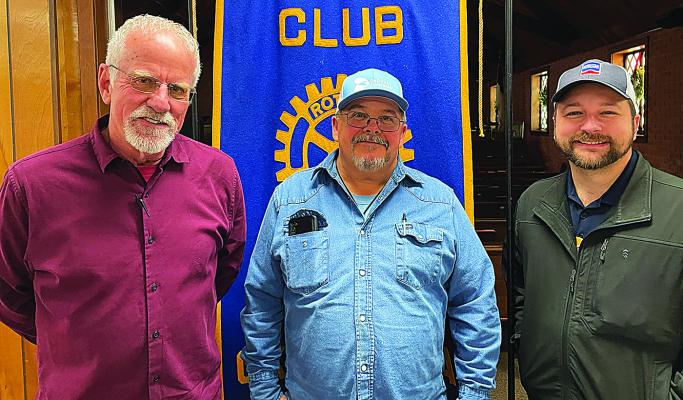 Choct aw County Dist rict 1 Commissioner Jim Bob Sullivan (center) spoke to the Hugo Rotary Club last week about District 1 and his first year in the position. Rotarians appreciate the work he and the other County Commissioners are doing. He is pictured here with Rotarians Brent Shain (left) and Colby Bryant (right).