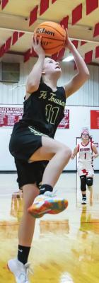 (LEFT) MACKENZIE WYATT breaks away to put up two points for the Lady Tigers in their battle with Soper.