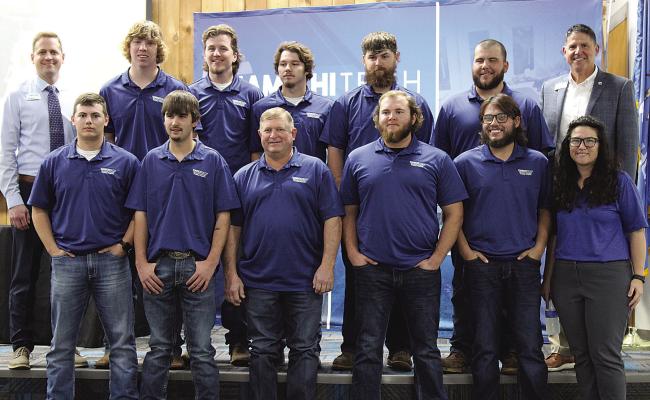 Pictured with the gradutates are Jerrod Lundry, Kiamichi Tech - Hugo Campus Director (top row, far left); Doug Hall, Kiamichi Tech Deputy Superintendent (top row, far right); and Lauren Wren, Kiamichi Tech - Hugo Workforce &amp; Economic Development Coordinator (bottom row, far right).