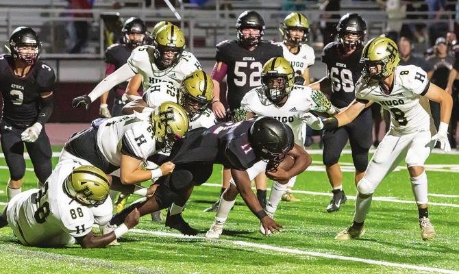 THE HUGO BUFFALO DEFENSE stepped up big time Friday in Atoka, shutting out the Wampus Cats on their home turf and giving Hugo its first District football win of the season. Above, G’Mariyon Wallace, Caleb Allen, Caleb Joe, Carlos King and Hunter Sims swarm an Atoka ball carrier for no gain. The Buffalo D will be tested on Buff Parker Field this Friday when Hugo hosts Eufaula in another District game. Hugo News Photo / Bobby Hamill