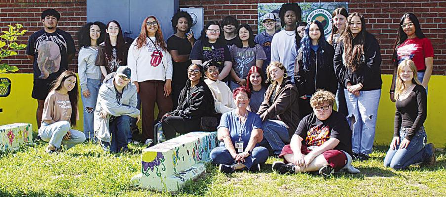 The Hugo High School Environmental Science students, along with a $3,500 Whole Foods Market Garden Grant, created a community garden. Students started the plants from seed in a greenhouse located in the classroom. The plants were then transplanted to the garden bins. The students planted the following vegetables and flowers: Lettuce. Asparagus. Beets. Onions. Potatoes. Carrots. English Peas. Green beans. Tomatoes. Tulips. Assortment of flowers.