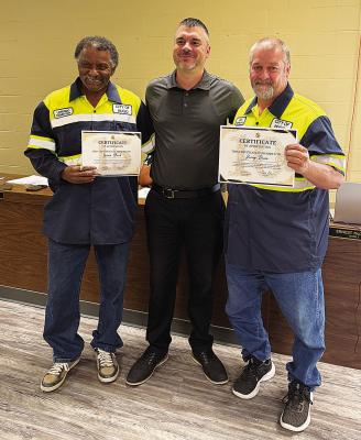 Two city employees received service awards during the most recent Hugo city council meeting. Pictured are (l to r): Lorenzo Black, Hugo city manager Justin Suddeth and Jerry Davis.