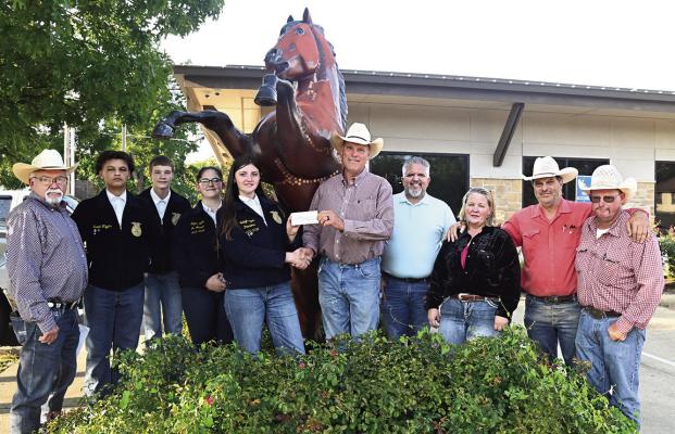 The Hugo PRCA Rodeo Committee recently made a $1,000 donation to the Hugo FFA Chapter. “The PRCA Rodeo Committee is proud to support all area FFA chapters and the future pro-rodeo contestants,” said Tom White. Pictured are (l to r): Richard Higginbotham, Isaiah Wiggins, Ayden Shannon, Shyann Steele, Jalee Loper, Tom White, FFA director Nathan Coulter, Melissa Drinkard, Jim White and Justin Morris. Hugo News / Stan Stamper