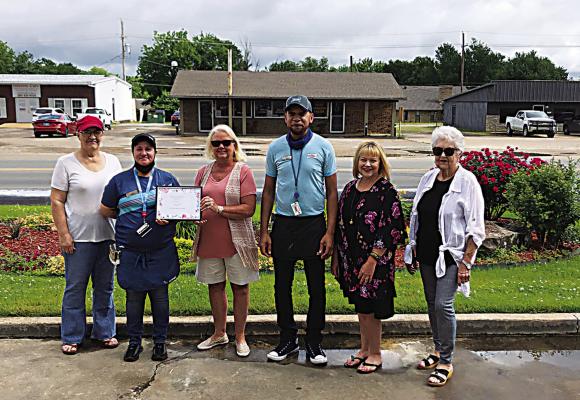 The Iris Garden Club presented a certificate of appreciation to the Sonic in Hugo to show their appreciation to them for their civic pride, their beautiful landscape, and maintenance of all the roses, shrubs and flowers. Pictured are Sonic employees and garden club members.