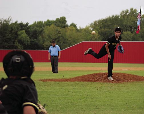 TRENTON TIMS sends a pitch to home plate for the Fort Towson Tigers last week in action against Soper. Waiting for the pitch is Tiger catcher Kameron Hammons. Hugo News Photo / Brian Moore