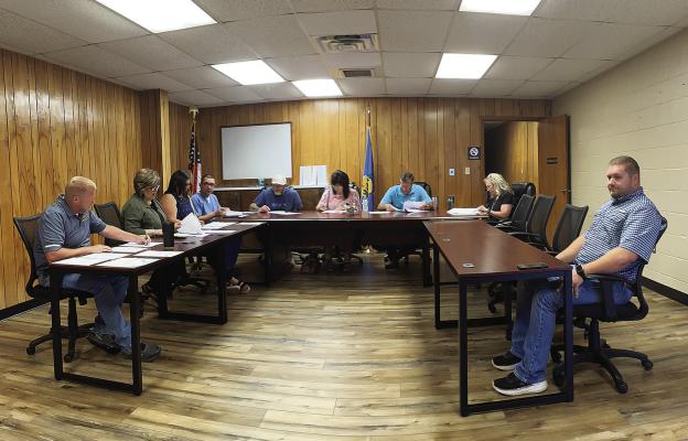 Hugo board of educatio n members accepted the resignation of Superintendent Corey Smith during last week’s meeting. Pictured are (l to r): Smith, Shelly Wilson, Kortney Kauss, Dr. Mike Irvin, Todd Beason, Michele Frazier, Dwight Kos, Susan Brewer and Shelby Dawes.