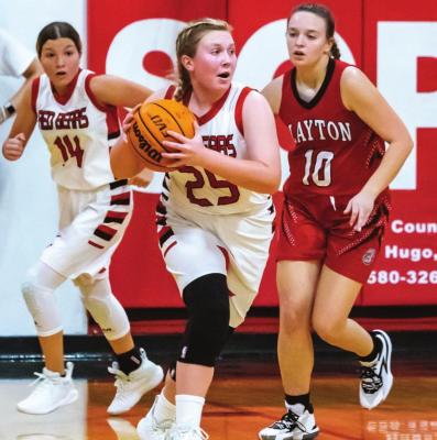 (Above,clockwise) Kirsten Harless looks for an outlet pass as teammate Finiti Funderburk hustles up the floor; Chloeaunna Madbull launches a 3-pointer and leads Soper scoring with 12 points; Emily Webb gets off a lay-up for the Lady Red Bears. Hugo News Photos / Bobby Hamill