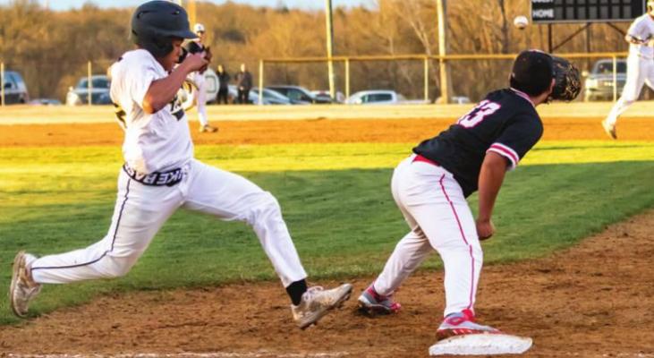TRYSTUNN FLEEKS is inches away from first base as an Idabel shortstop makes the throw. The Buffaloes pounded out 15 hits and made no errors in their home opener and are back in action this week on the road. (Hugo News Photo / Bobby Hamill)