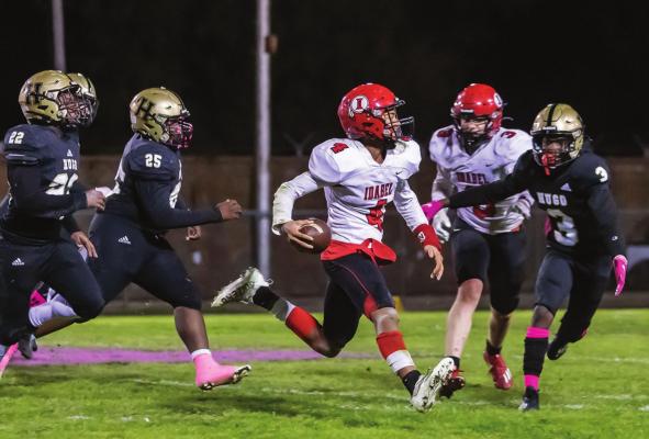 HUGO BUFFALO SOPHOMORE DEFEDER CARLOS KING rushes up from his secondary position to cut off an Idabel ball carrier during Friday’s big District victory over the Idabel Warriors. Assisting King are Buffalo defenders Da’Shon Sims and De’Koryian Mitchell. The Buffaloes held the Warriors scoreless in the second half, while putting up 37 unanswered points, thanks to a great defensive effort. Hugo News Photo / Bobby Hamill