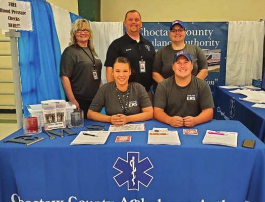 CHOCTAW COUNTY Ambulance Authority Executive Director Randy Springfield (back row, center) stands by other representatives of the agency who manned a booth at the County Fair this past week.
