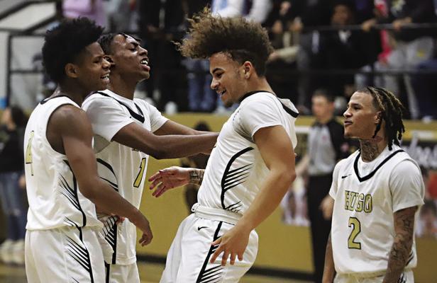 QUINCY SHELTON, LORENZO KING and TRAVION KING celebrate with Damarion Ramsey after Ramsey dropped a key trey against the Broken Bow Savages. Hugo News Photo / Kelli Stacy