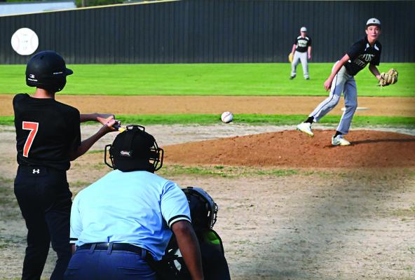 HUGO BUFFALO PITCHER JACE BAKER fires a strike to a Valliant Bulldog batter during Monday’s clash in Hugo between the two Middle School teams. The Buffaloes battled to break a 6-6 tie in the final inning to claim a narrow 7-6 win. Hugo News Photo / Stan Stamper