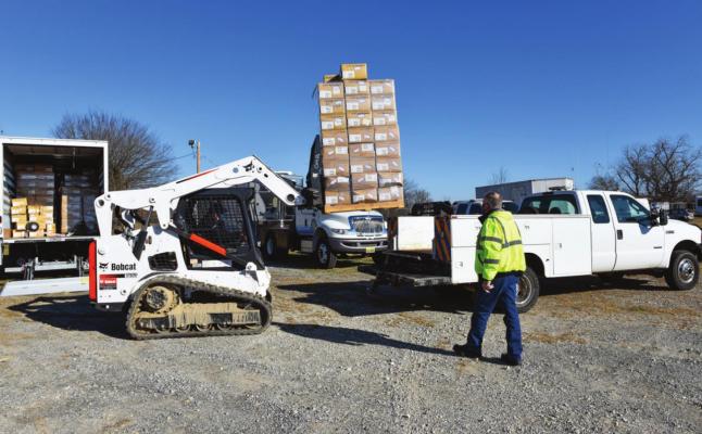 City of Durant picks up their first pallet of masks for distribution.