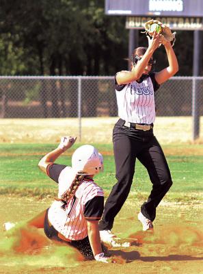 HUGO LADY BUFFALO SENIOR SHORTSTOP KINSLEY JOHNSON takes a high throw to second base to force an out against Valliant in softball action last week in Hugo. Brian Moore Photo