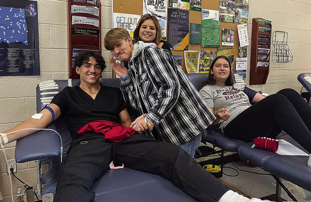 Hugo High School students donate at OBI Blood Drive hosted by the Leo Club on Sept. 7 at Hugo High. Pictured are: Zion Siniga, Chad Barnett, Riley Janoe and Sophia Bobb.