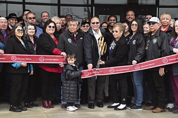 CHOCTAW NATION CHIEF GARY BATTON was among a number of tribal dignitaries last week during the formal ribbon cutting ceremonies opening the new $26-million dollar Choctaw Nation business complex in Hugo. The 52,000 sq. ft. building centralizes a number of tribal operations, including Housing, Children and Family Services, Education, Career Development, High School Student Services and Higher Education. See more photos and details inside today’s Hugo News on page 7B. Hugo News Photo / Stan Stamper