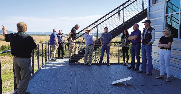 Oklahoma representatives at Daisy Ranch listen to a presentation from James Grimsley, the Choctaw Nation of Oklahoma’s executive director of advanced technology initiatives.