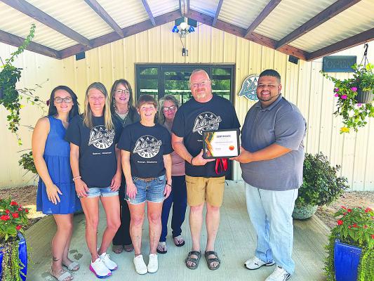 The Hugo Area Cha mber of Commerce held a Ribbon Cutting ceremony last week for Lakeside Bar &amp; Grill. Lakeside Bar &amp; Grill is owned by Rodney and Pattie Thompson, and offers a lively atmosphere with daily food specials, live entertainment and exciting events. It is located at 1083 N. 4290 Rd. in Sawyer, just inside Shady Oaks RV Resort. Pictured at the ribbon cutting are (l to r): Tiffany Brockway, Jana Kirby, Valerie Powell, Lena Kopp, Pattie and Rodney Thompson and Ernest McCarty.