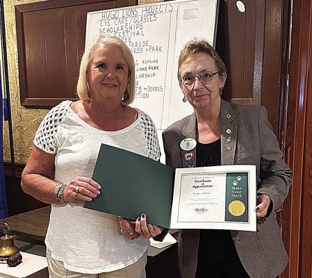 Lions past president Harolynn Wofford received an award from District Governor Nancy Wood at Lions Club. It was the Make your Mark award from International President Fabrico Oliveira for club growth.