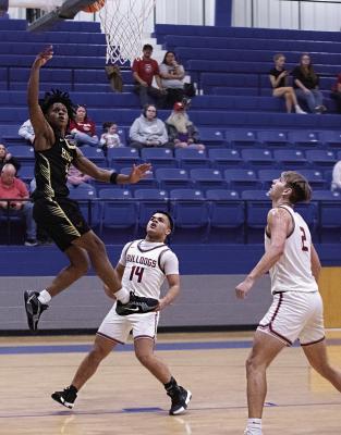 LORENZO KING sails through the paint and puts up two points for the Hugo Buffaloes in State Playoff action against Valliant. King is expected to return to the Buffs’ squad next season and take on a leadership role as a senior. Hugo News Photo / Kelli Stacy